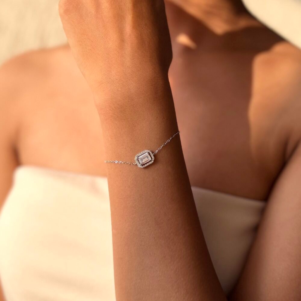 delicate 925 Sterling Silver bracelet with a rectangular centerpiece worn on the wrist, available in silver, rose gold, and gold finishes.