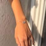 delicate 925 Sterling Silver bracelet with a rectangular centerpiece worn on the wrist, available in silver, rose gold, and gold finishes.