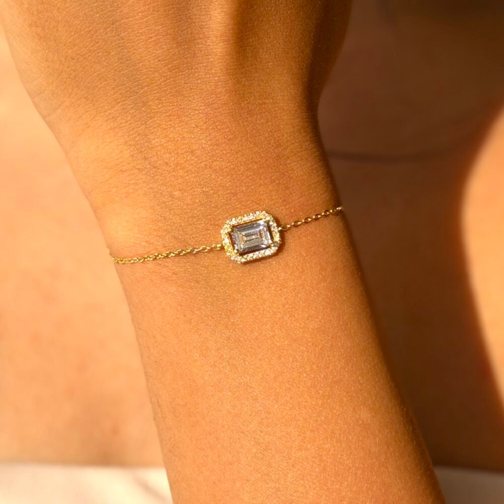 delicate 925 Sterling Silver bracelet with a rectangular centerpiece worn on the wrist, available in silver, rose gold, and gold finishes.