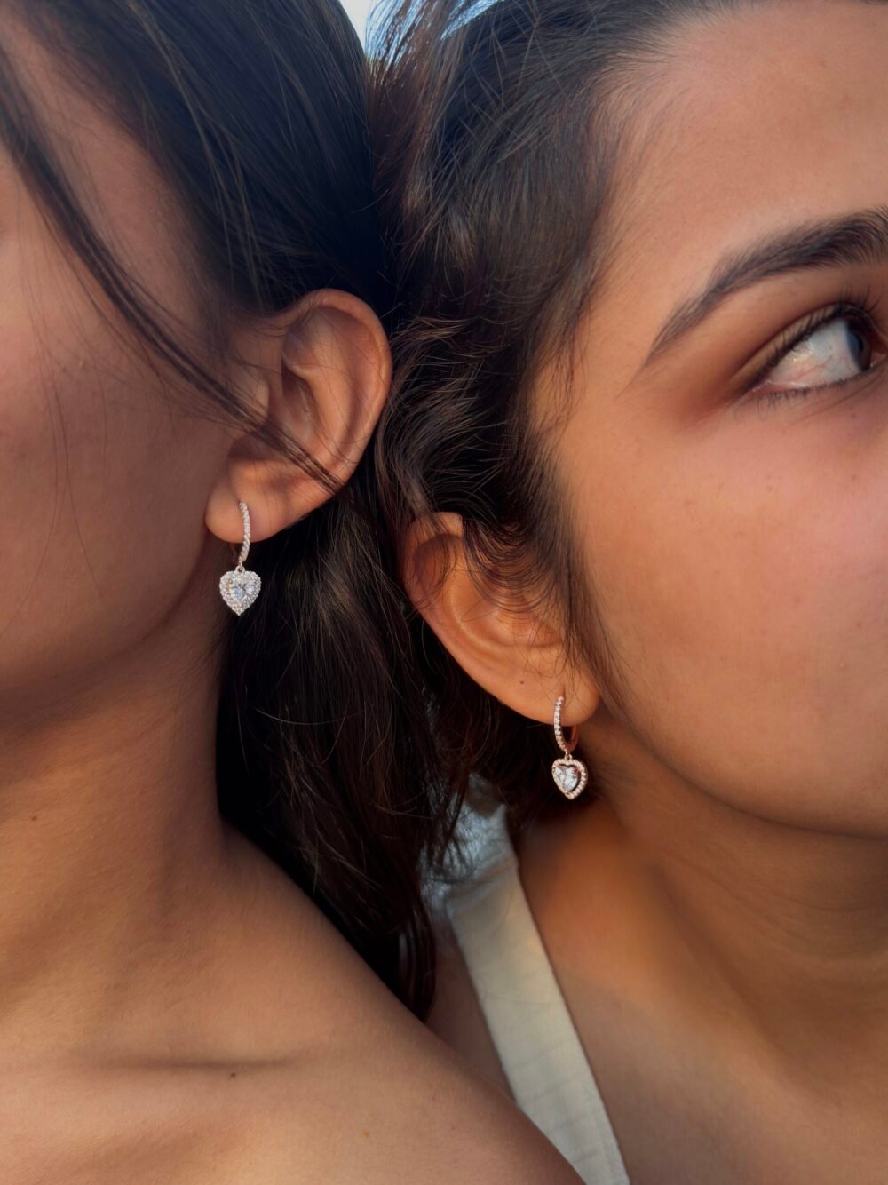 Amora heart-shaped huggie earrings made from 925 Sterling Silver with solitaire stone, available in Rose Gold, Gold, and Silver